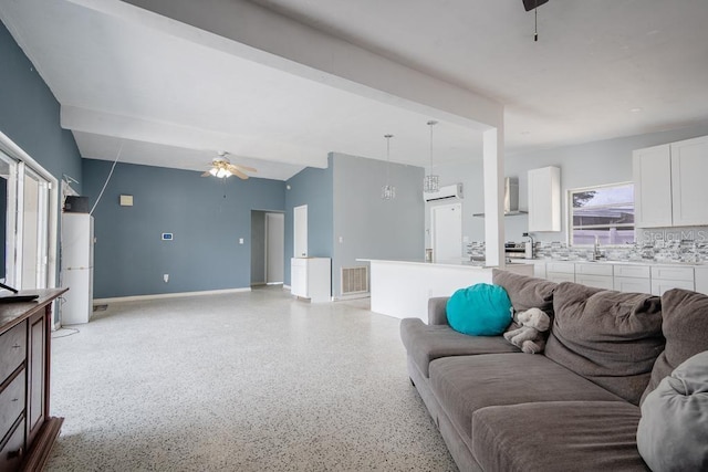 living room with vaulted ceiling and ceiling fan