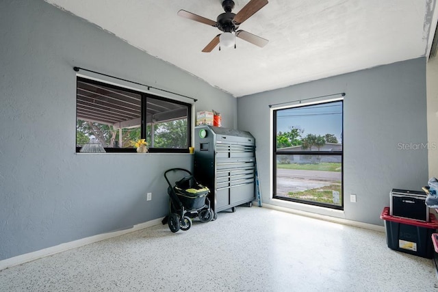 miscellaneous room with lofted ceiling and ceiling fan