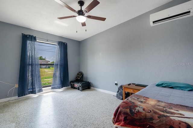 bedroom with a wall mounted air conditioner and ceiling fan