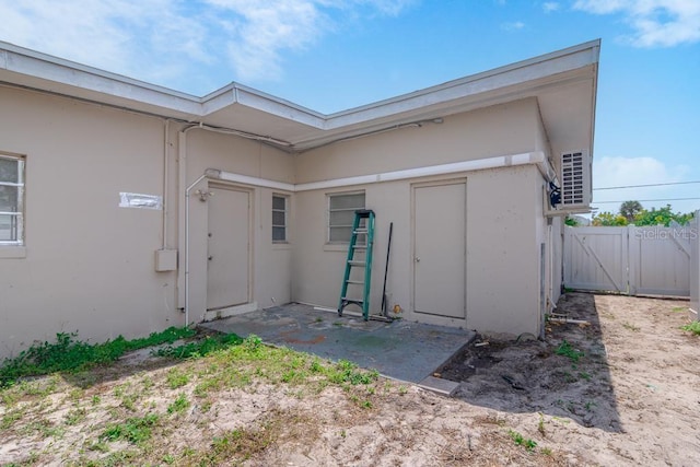 property entrance featuring a patio