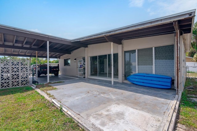 exterior space with a carport