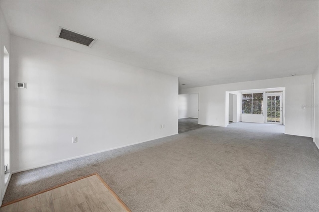 unfurnished living room featuring wood-type flooring