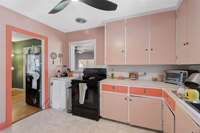 kitchen with a toaster, visible vents, ceiling fan, light countertops, and black appliances