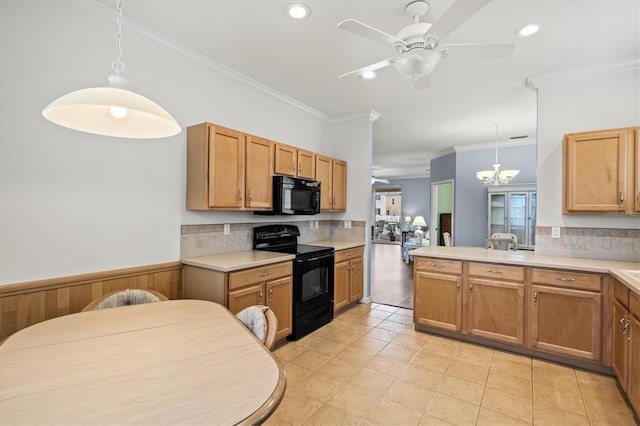 kitchen featuring pendant lighting, a ceiling fan, light countertops, black appliances, and crown molding