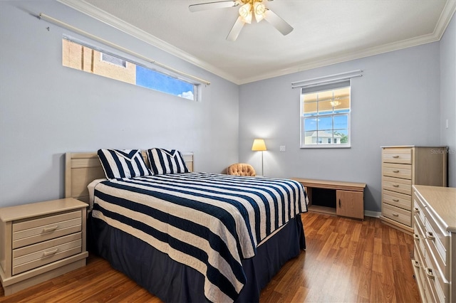 bedroom with ornamental molding, light wood-type flooring, and multiple windows