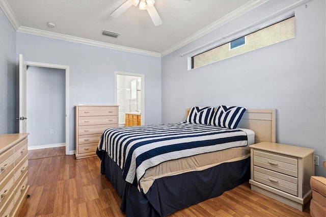 bedroom with ceiling fan, light wood-type flooring, visible vents, and crown molding