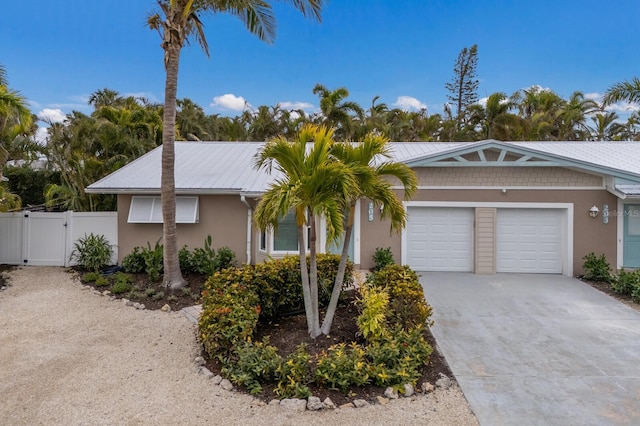 single story home featuring a garage