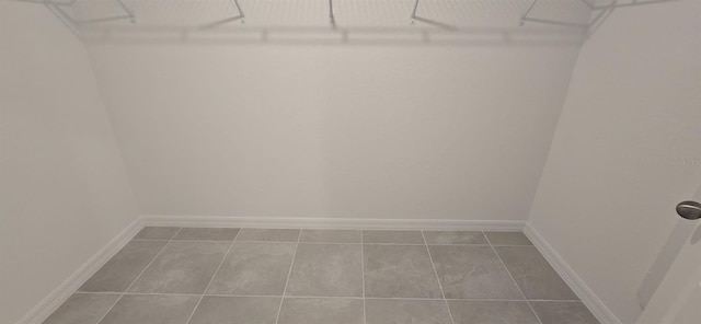 spacious closet featuring tile patterned flooring