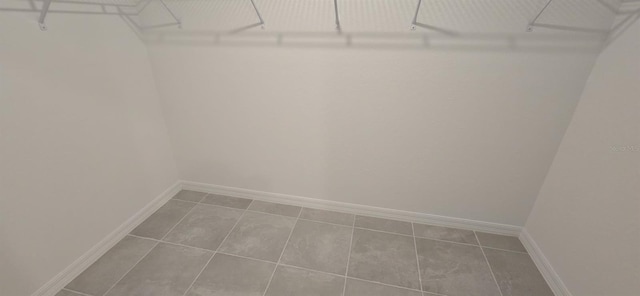 spacious closet with tile patterned flooring