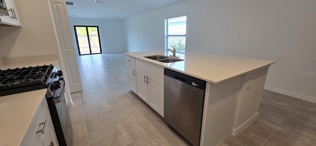 kitchen with sink, dishwasher, white cabinetry, a center island with sink, and gas range