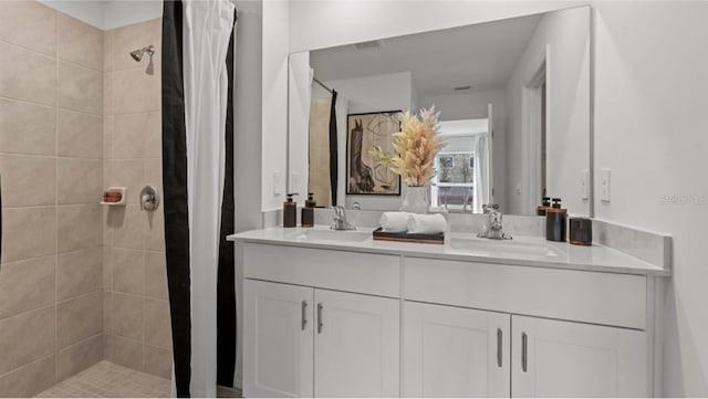 bathroom featuring vanity and a shower with shower curtain