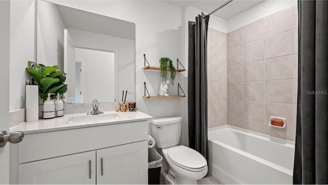 full bathroom with vanity, shower / tub combo, and toilet