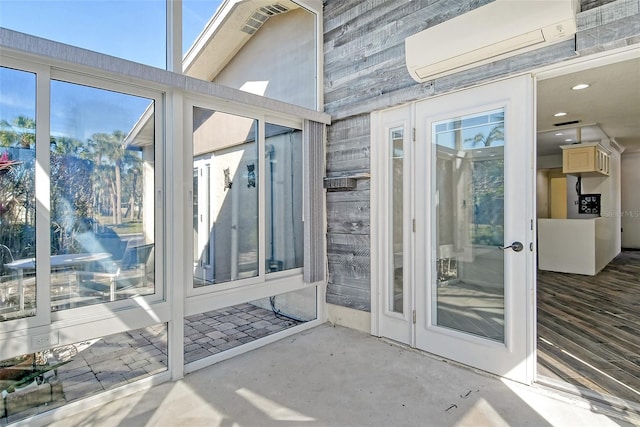 sunroom with a wall mounted air conditioner