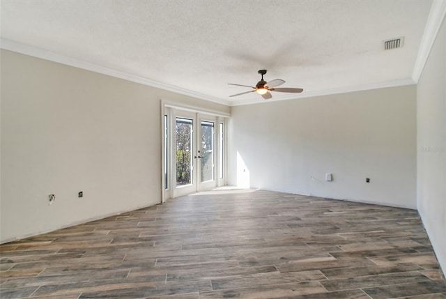 unfurnished room with french doors, ornamental molding, wood finished floors, and visible vents