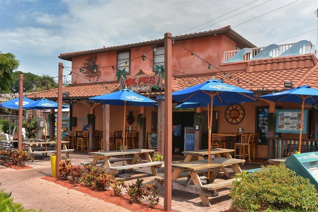 exterior space with a tile roof