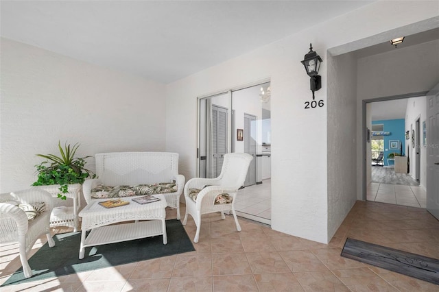 sitting room featuring light tile patterned floors