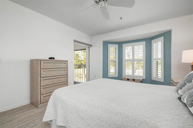 carpeted bedroom with ceiling fan and access to outside