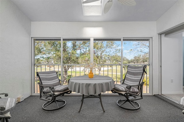 sunroom featuring plenty of natural light and ceiling fan