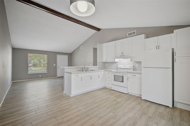 kitchen with sink, white appliances, vaulted ceiling with beams, and white cabinets