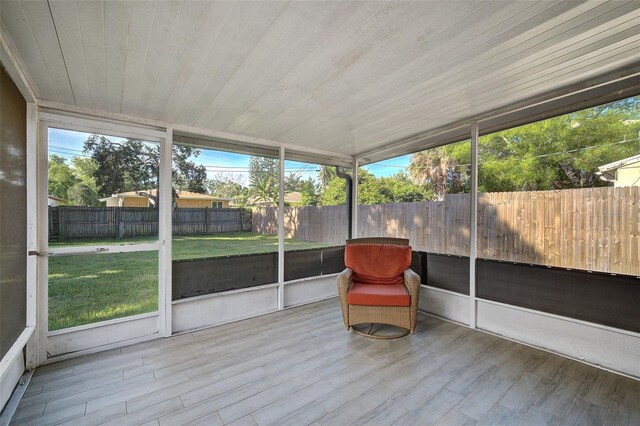 unfurnished sunroom featuring wooden ceiling