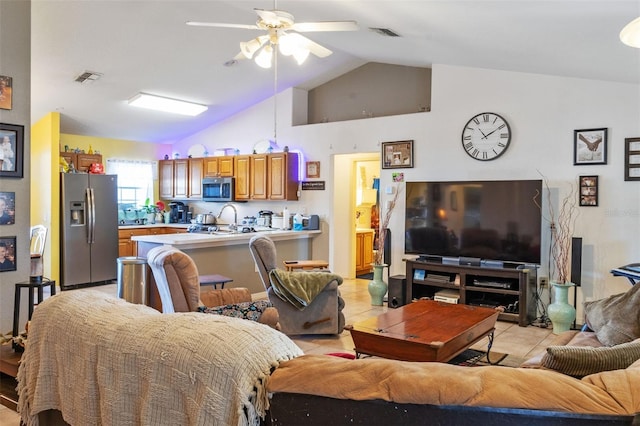 tiled living room with lofted ceiling and ceiling fan