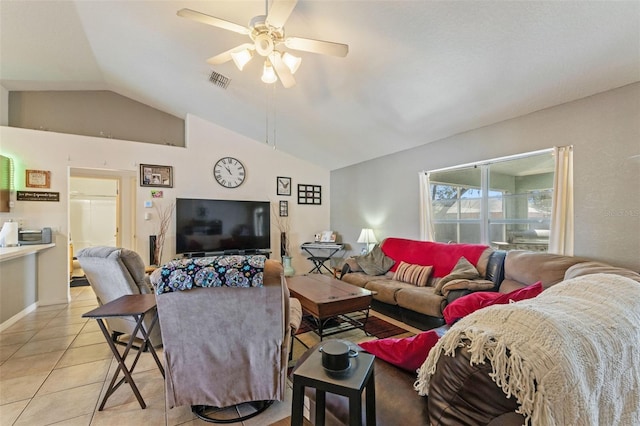 tiled living room featuring ceiling fan and vaulted ceiling