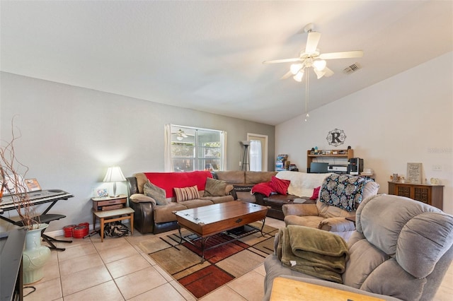 living room with light tile patterned floors, vaulted ceiling, and ceiling fan