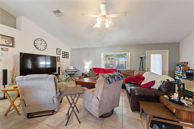 living room featuring lofted ceiling, light tile patterned floors, and ceiling fan