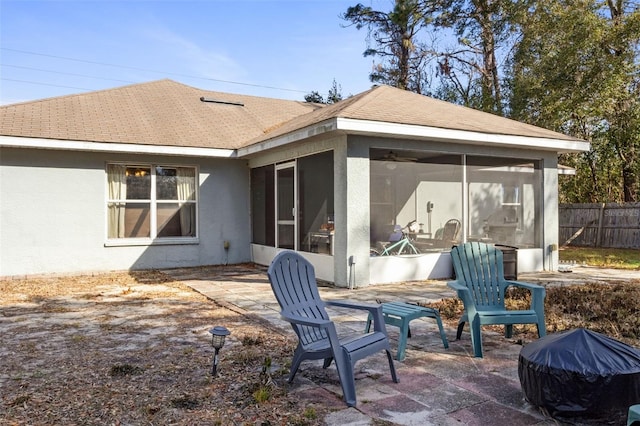 back of house with a sunroom and a patio