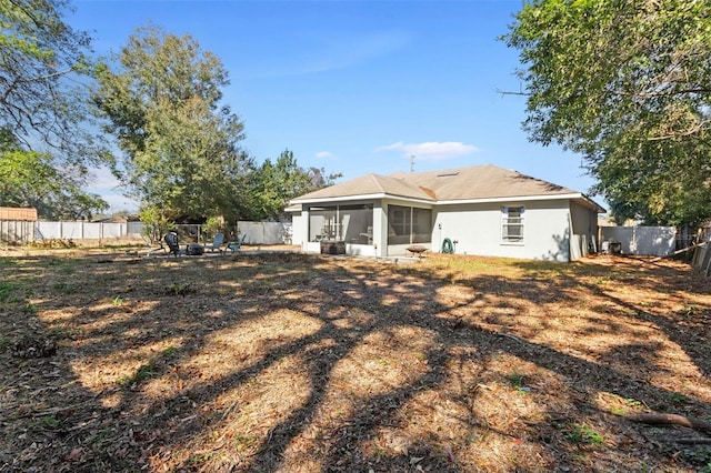 back of house with a sunroom