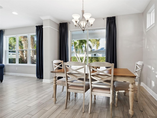 dining space with an inviting chandelier and light wood-type flooring