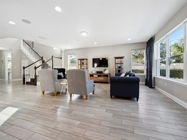 living room with a wealth of natural light and decorative columns