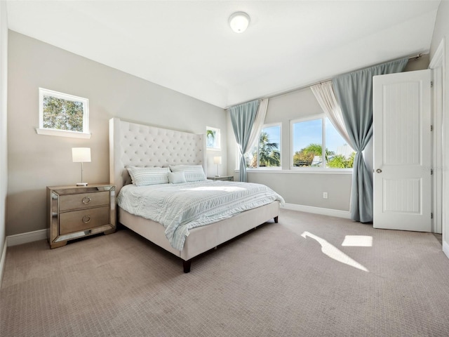 bedroom featuring light colored carpet