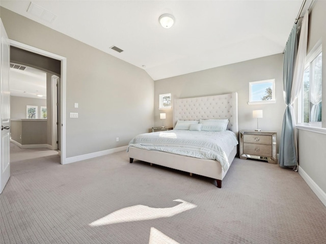 carpeted bedroom featuring vaulted ceiling