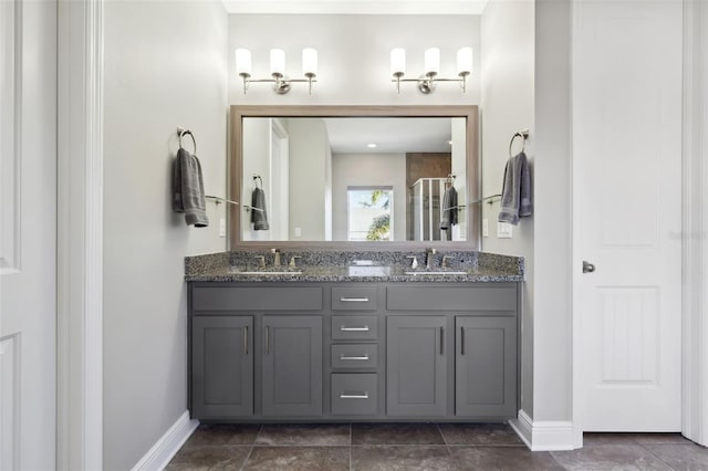 bathroom featuring vanity, an enclosed shower, and tile patterned floors