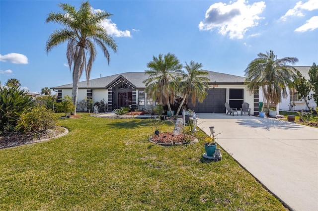 single story home with a garage and a front lawn