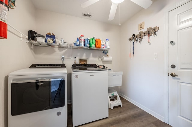 laundry area featuring separate washer and dryer, dark hardwood / wood-style floors, and ceiling fan