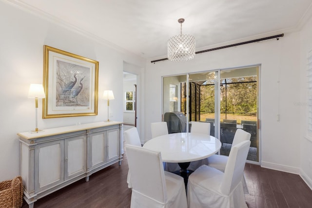 dining area with an inviting chandelier, crown molding, and dark wood-type flooring