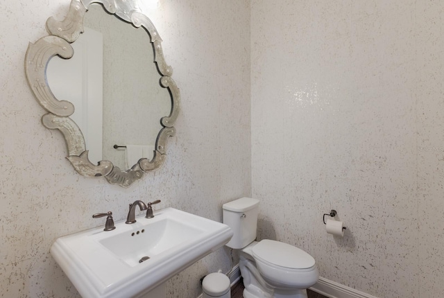 bathroom featuring sink and toilet