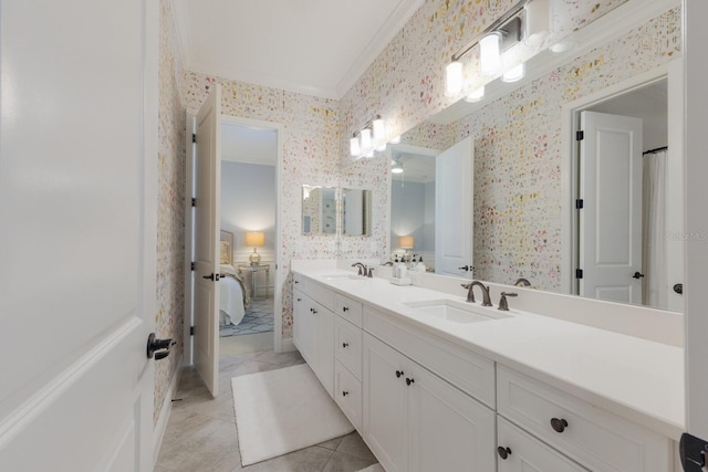 bathroom featuring crown molding and vanity