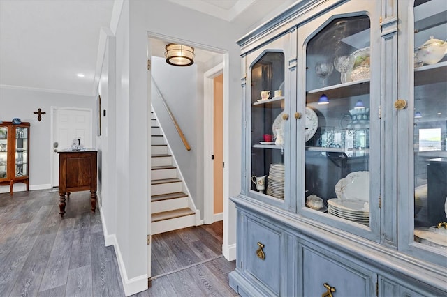 details featuring ornamental molding and hardwood / wood-style floors