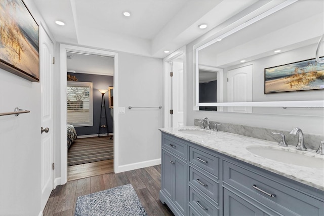 bathroom featuring hardwood / wood-style flooring and vanity