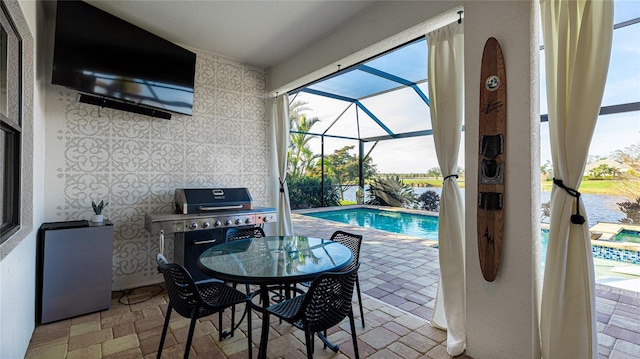 view of patio with a lanai and grilling area