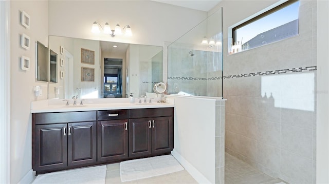 bathroom featuring vanity and a tile shower