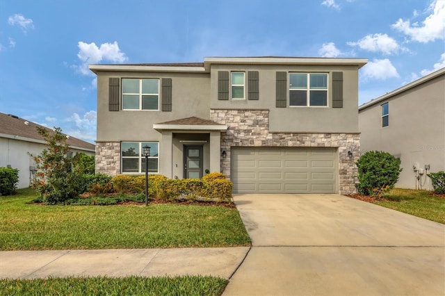 view of front of property with a garage and a front lawn