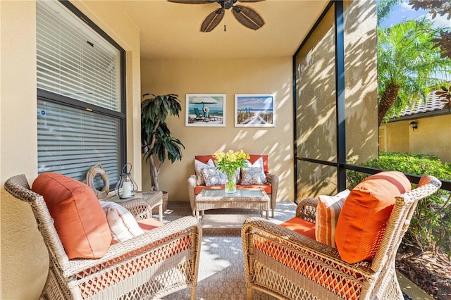 sunroom / solarium featuring ceiling fan