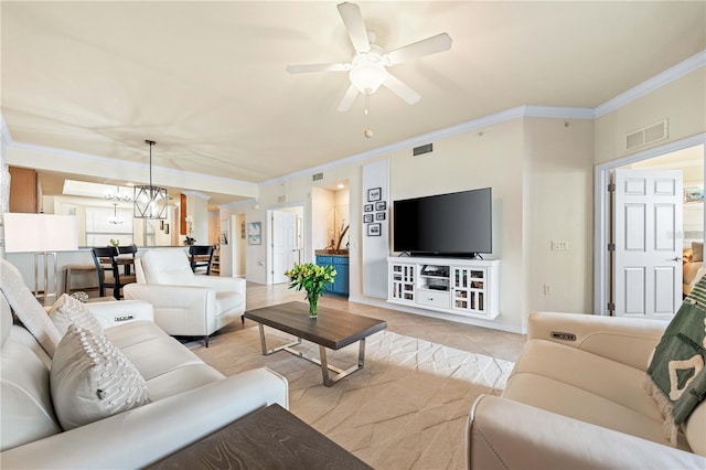 tiled living room with ornamental molding and ceiling fan with notable chandelier