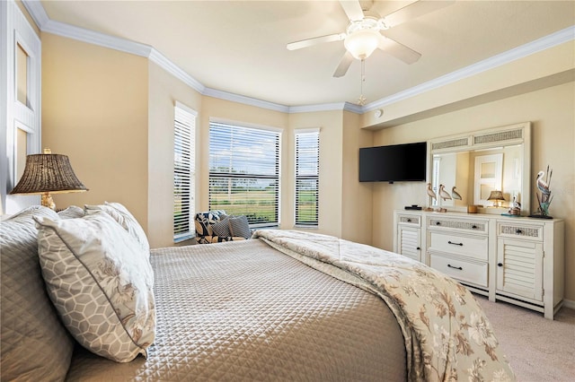 bedroom with ceiling fan, light colored carpet, and ornamental molding