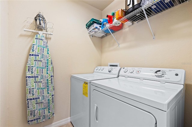 clothes washing area featuring washing machine and dryer