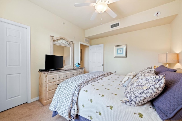 bedroom featuring light colored carpet and ceiling fan